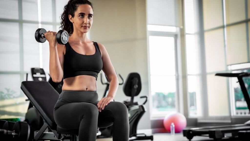 women performing strength training with weights